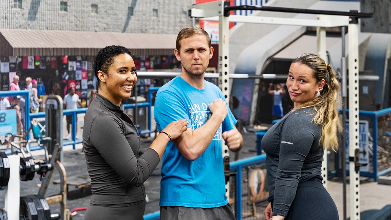 Silly gym photo of three Velasea employees flexing